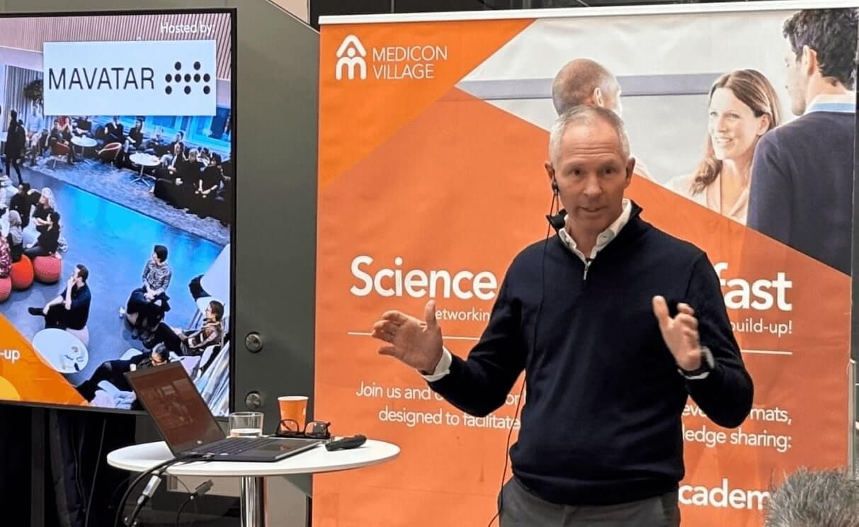 Mavatar CEO standing in front of a crowd.